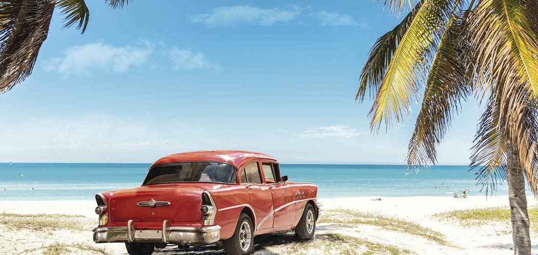 old red american car on Varadero Beach in Cuba