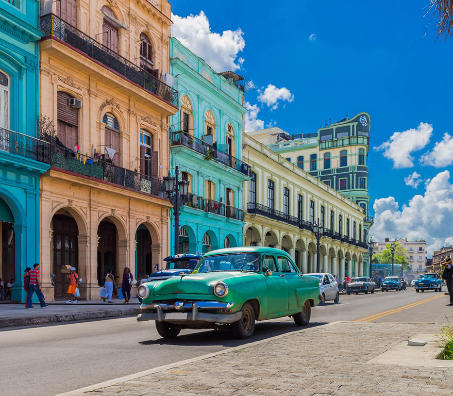 Cityscape with american green vintage car on the main street in Havana City Cuba - Serie Cuba Reportage