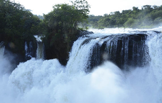 Waters of Murchison Falls as they fall into a 40 meter deep 
