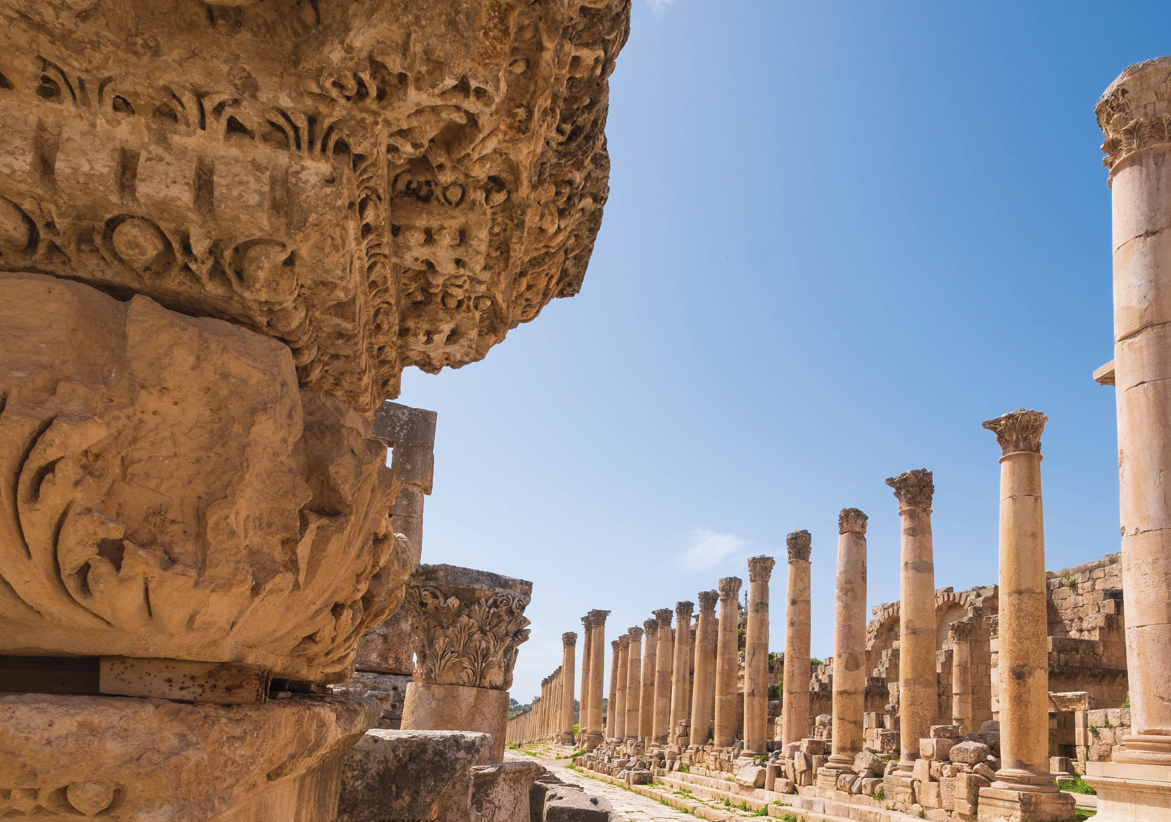a stone ornament of column base on the ruins of the city of Jerash in Jordan in spring