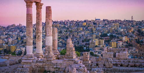 Amman, Jordan its Roman ruins in the middle of the ancient citadel park in the center of the city  Sunset on Skyline of Amman and old town of the city with nice view over historic capital of Jordan 