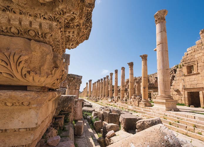 a stone ornament of column base on the ruins of the city of Jerash in Jordan in spring
