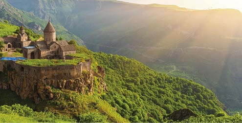 Ancient monastery in setting sun  Tatev  Armenia