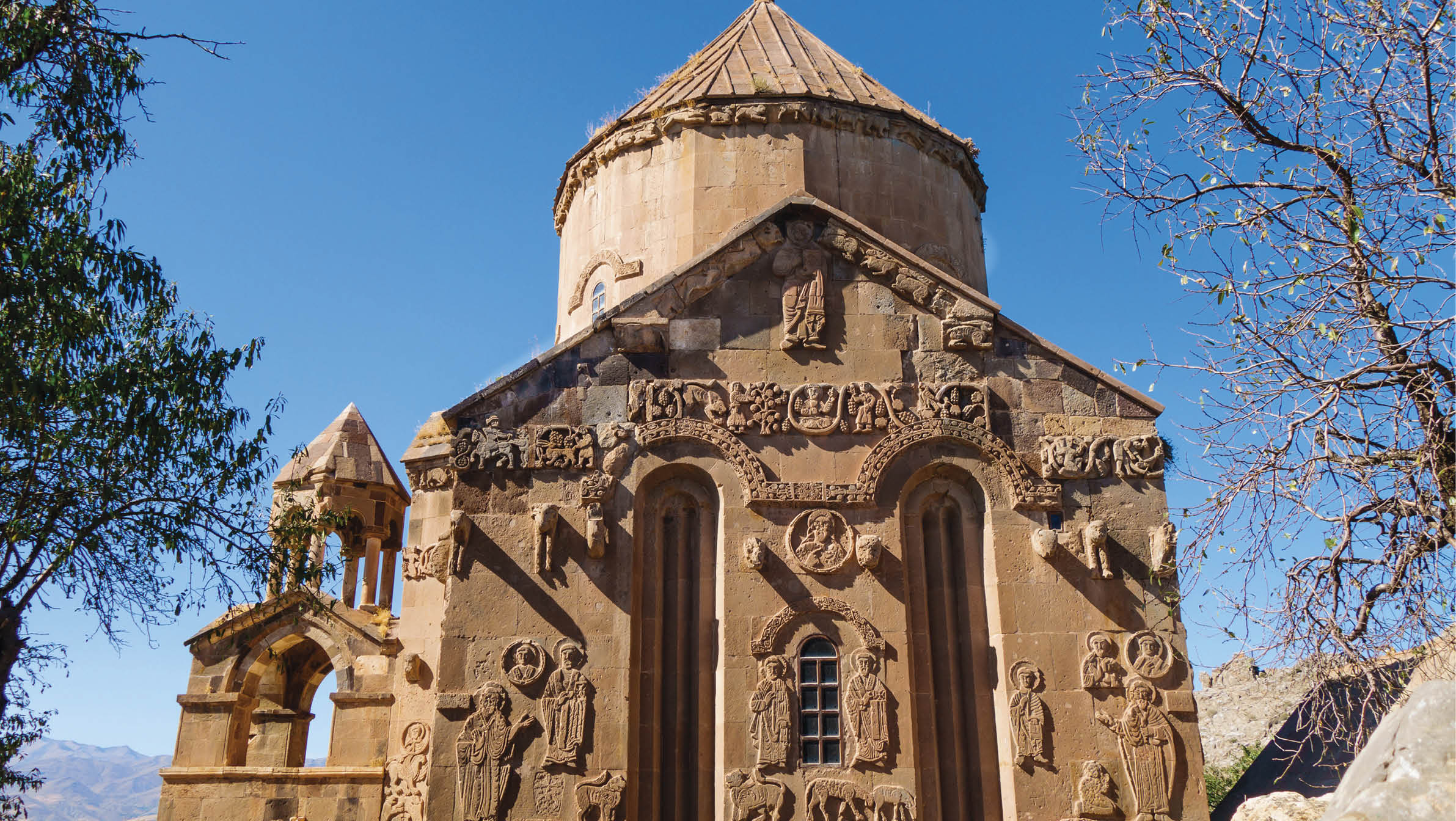 Eastern side of medieval Armenian Cathedral of Holy Cross & its bas-reliefs, Akdamar island, Van Lake, Gevaş Turkey  Church is richly decorated by bas-reliefs  It was built in 921 as church for king