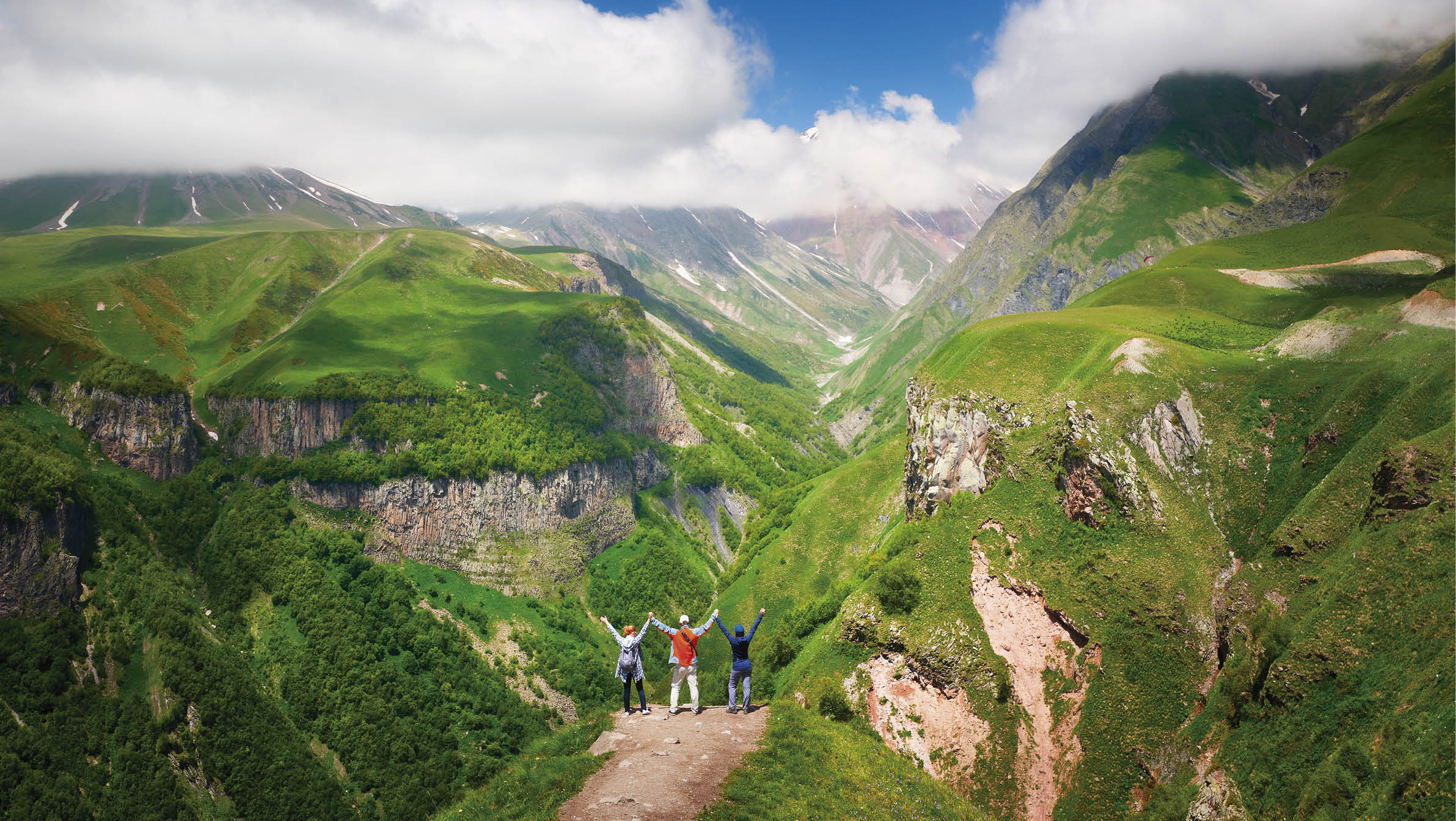 Happy group of tourists enjoying view mountains during summer vacation in Georgia(country)  Beautiful inspirational landscape, travel and activity 
