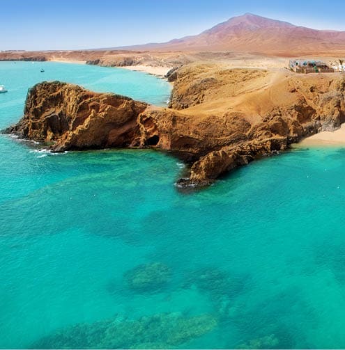 Lanzarote Papagayo turquoise beach and Ajaches in Canary Islands