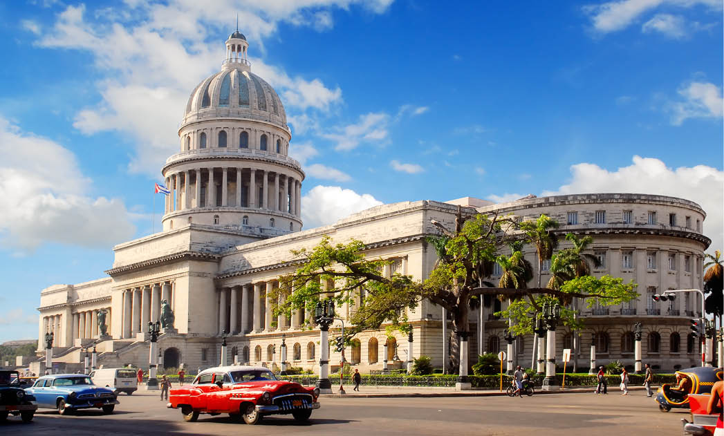 Capitolio building Havana, Cuba with vintage old cars