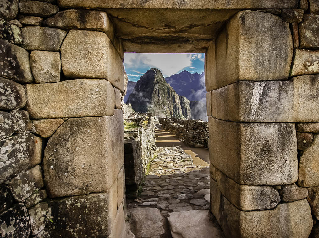 Doorway at Machu Picchu frames a view of Huayna Picchu,  Machu Picchu, Unesco World Heritage site, Sacred Valley, Peru 