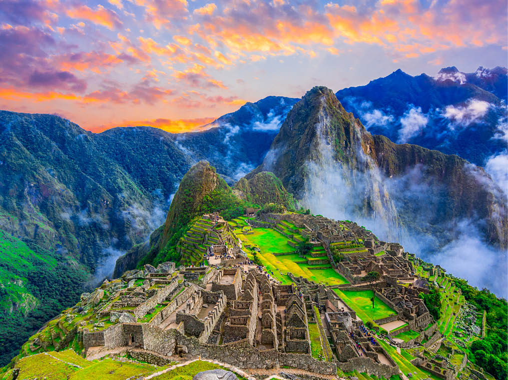 Machu Picchu, Cusco,Peru: Overview of the lost inca city Machu Picchu, agriculture terraces and Wayna Picchu, peak in the background,before sunrise