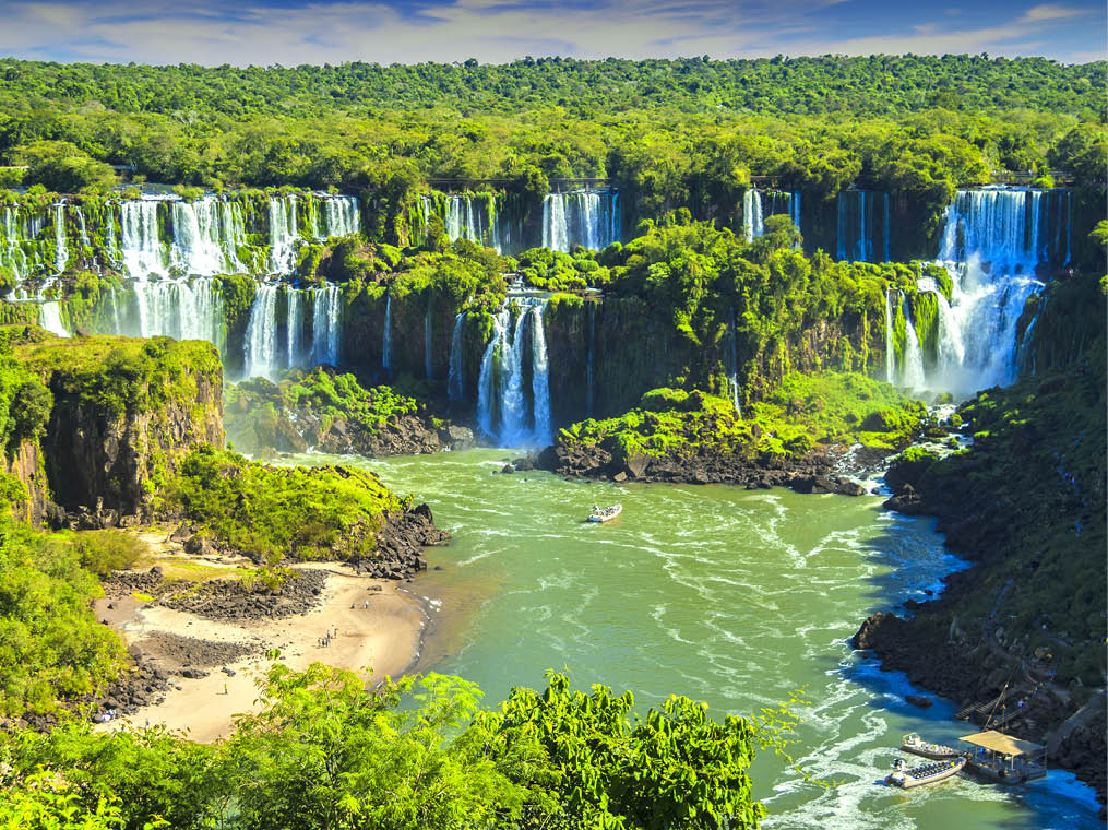 Argentina - Misiones - Iguazu falls - Impressive panorama view of Argentine side of Iguazu waterfall flows and streams falling down to Parana river surrounded by tropical jungle forest