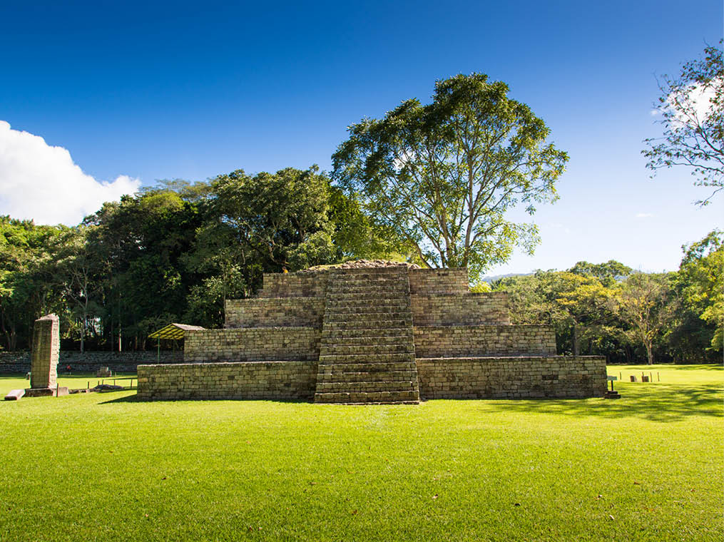 Blue sky day in an ancient pyramid at pre-columbian city of Copan, Honduras