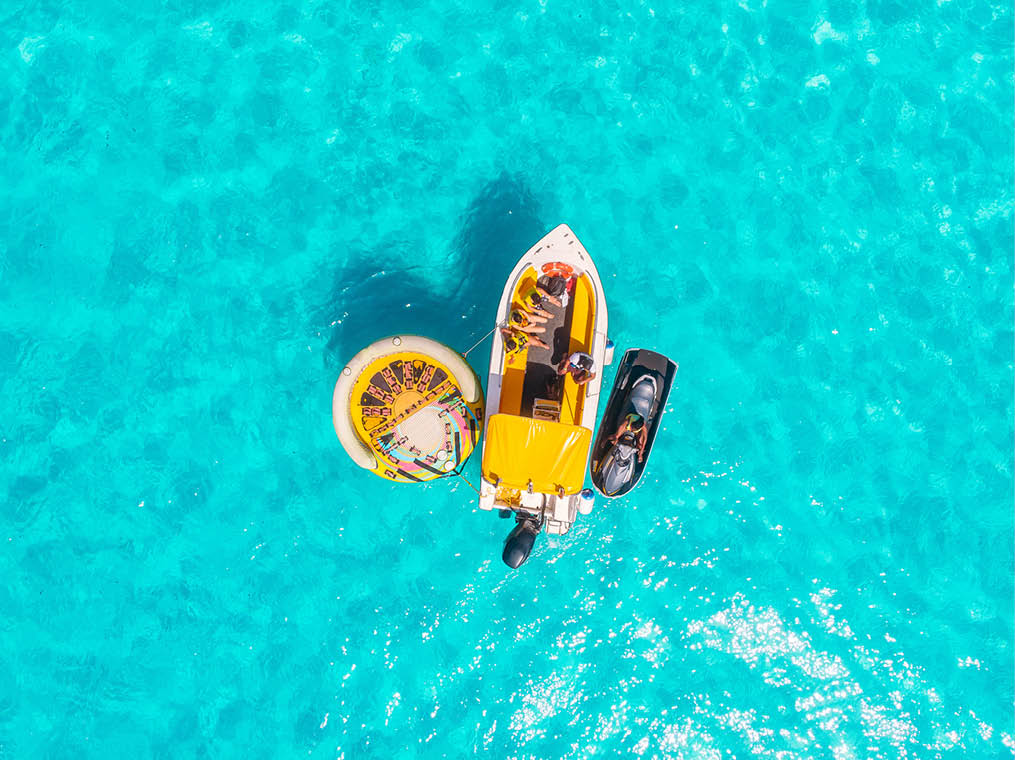 Pleasure wooden ship with mast in clear blue sea  Aerial view