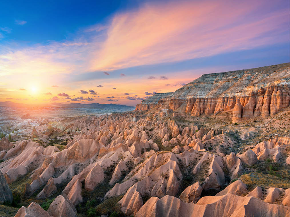 Beautiful mountains and Red valley  at sunset in Goreme, Cappadocia in Turkey 