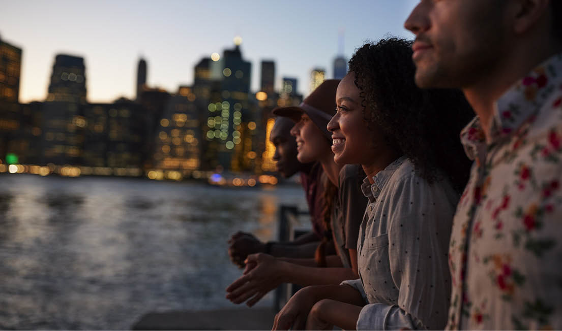 Group Of Young Friends On Trip To Manhattan At Dusk