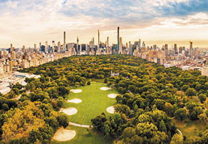 Aerial panorama of New York midtown skyline at sunset viewed from above Central Park 
