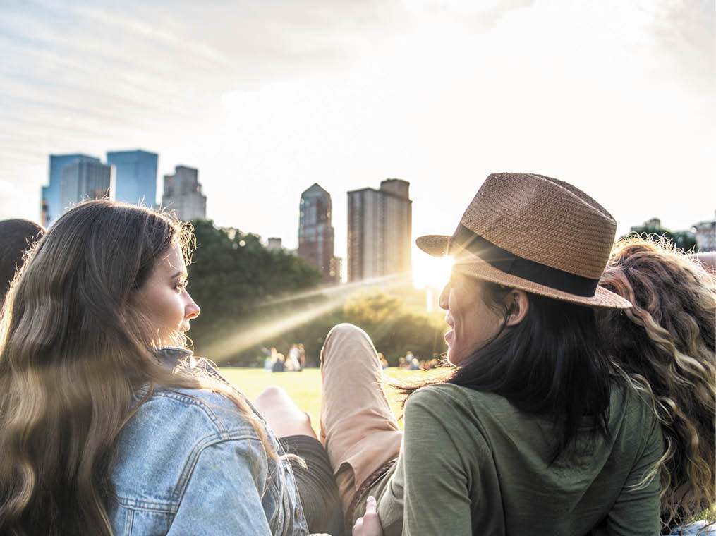 Multi-ethnic group of friends in Central Park, Manhattan - Young cheerful people bonding outdoors