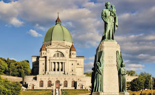St Joseph Oratory and St Joseph monument, at sunset, with cloudy sky