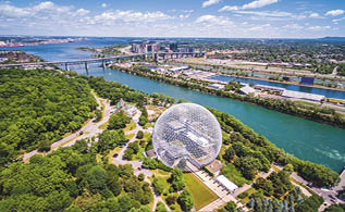 Montreal, Canada - July 3, 2016: Aerial view of the Montreal Biosphere and Jacques Cartier bridge in Montreal, Quebec, Canada 
