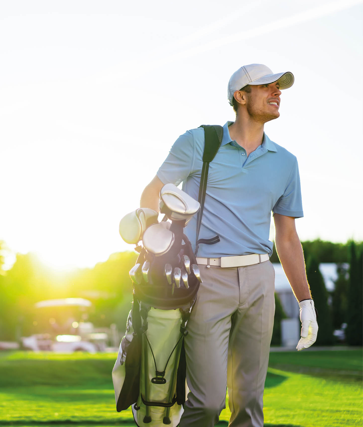 Young man playing golf outdoors