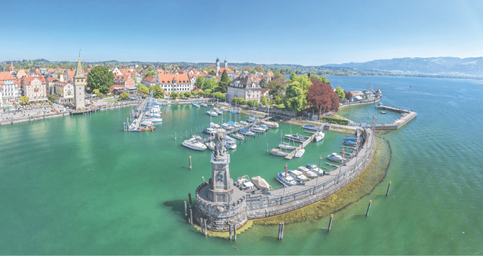 Harbor on Lake Constance with statue of lion at the entrance in Lindau, Bavaria, Germany