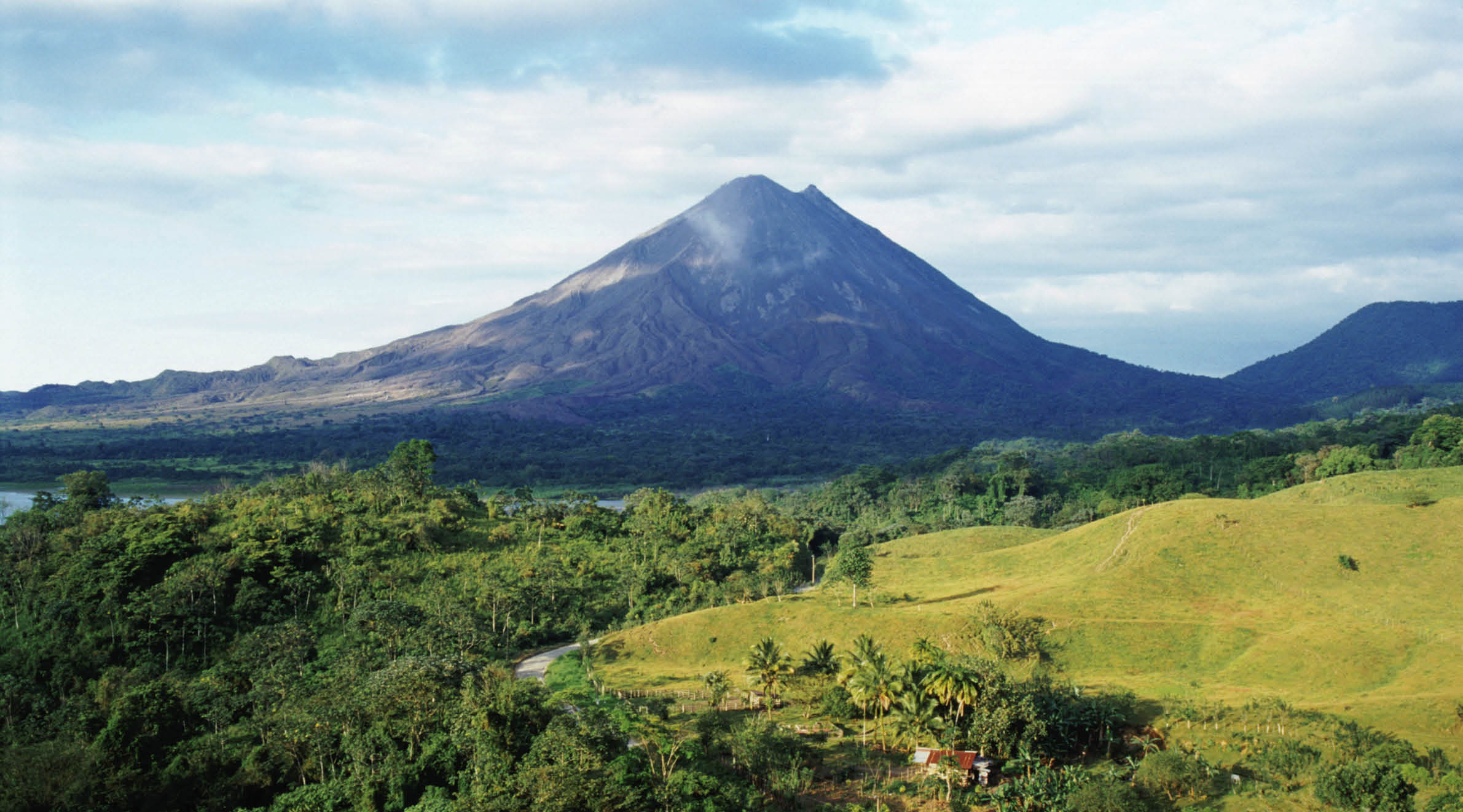 Farm land and rain forest surrounding the Arenal Volcano in Costa Rica, Central America.