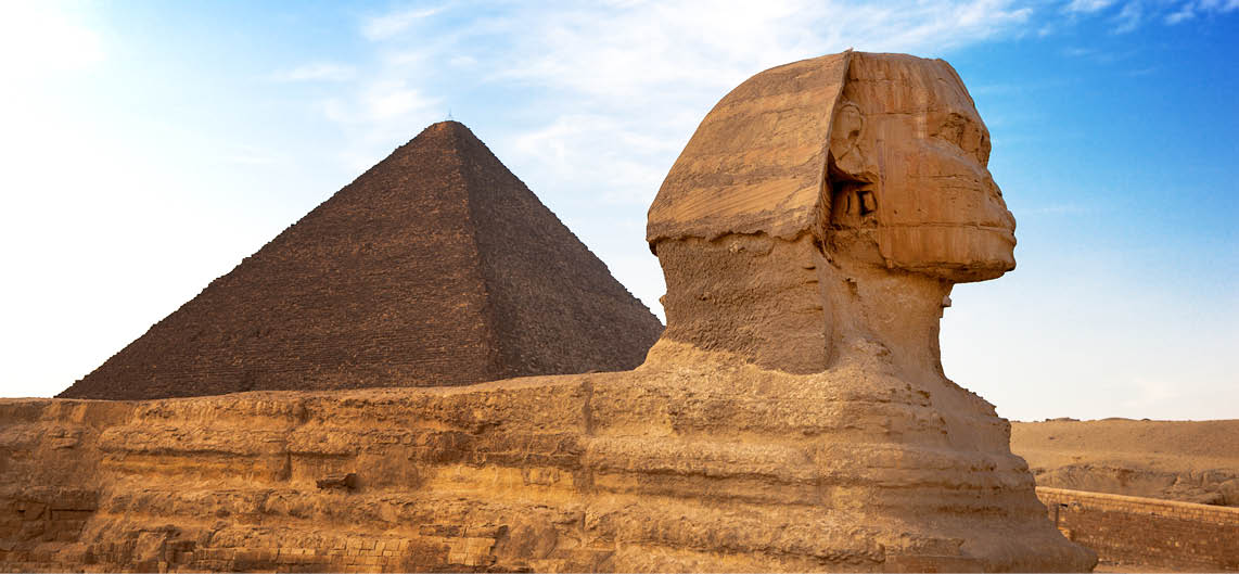 Sphinx and Pyramid Giza, Egypt. The Great Pyramid of Giza is one of the original Seven Wonders of the World.  