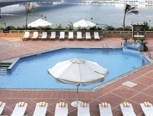Practise your breaststroke in the sun-drenched outdoor swimming pool overlooking the Nile at the Ramses Hilton hotel  Guests love the poolside terrace - there are loungers to relax on, sunshades and a light meal and snack service 