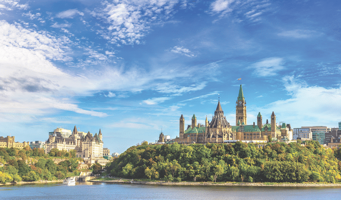 Canadian Parliament in Ottawa and river in a sunny day, Canada