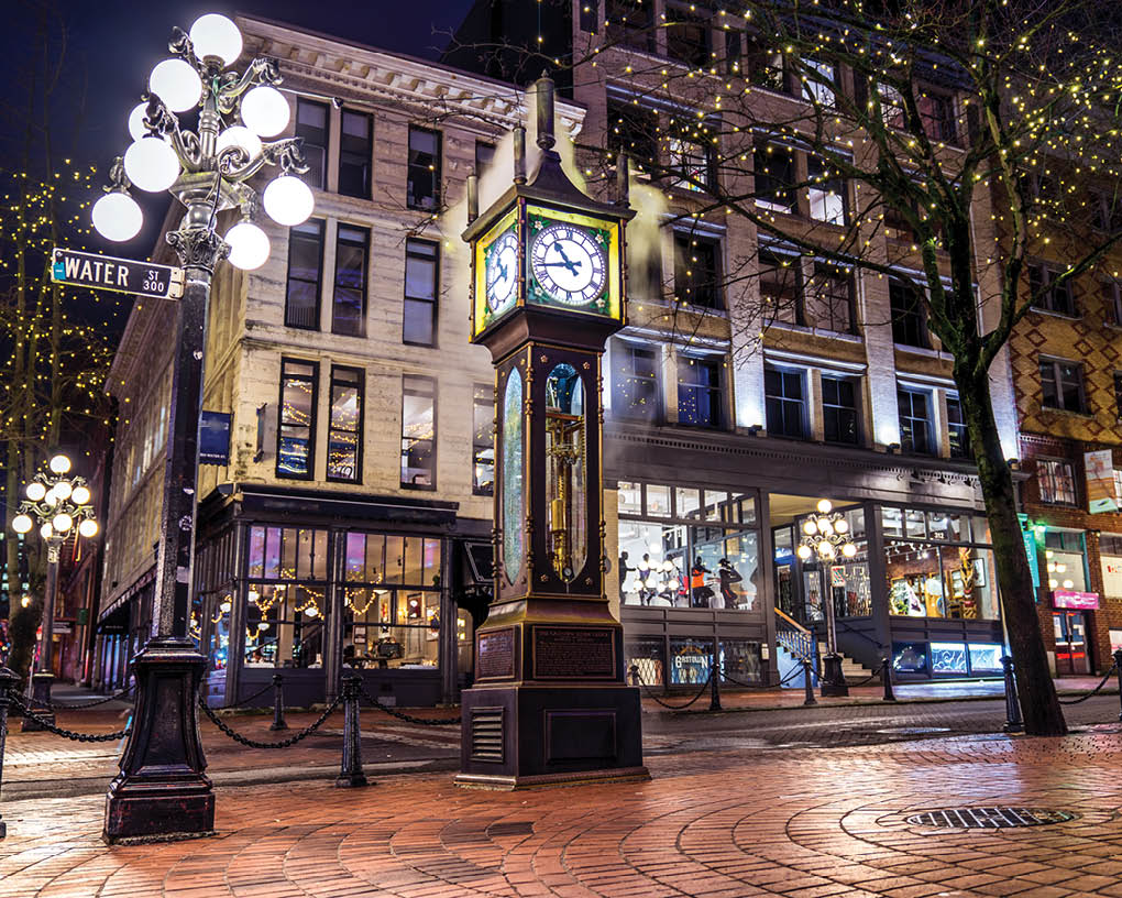 Vancouver, British Columbia - Canada  Downtown iconic landmark on a chilly night just after a rain, the Steam Clock, Gastown- Vancouver, British Columbia, Canada 
