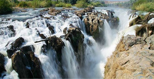 Epupa Falls (also known as Monte Negro Falls in Angola) is a series of large waterfalls created by the Cunene River on the border of Angola and Namibia, in the Kaokoland area of the Kunene Region.
