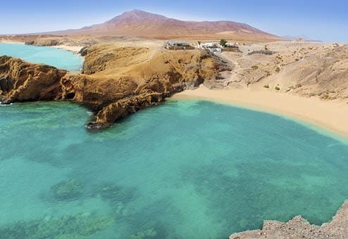 Lanzarote Papagayo turquoise beach and Ajaches in Canary Islands