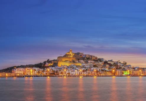 Beautiful view on Ibiza Town (Eivissa) at sunset. The historic fortified center, Dalt Vila (the upper town) and the cathedral of Ibiza in warm light.