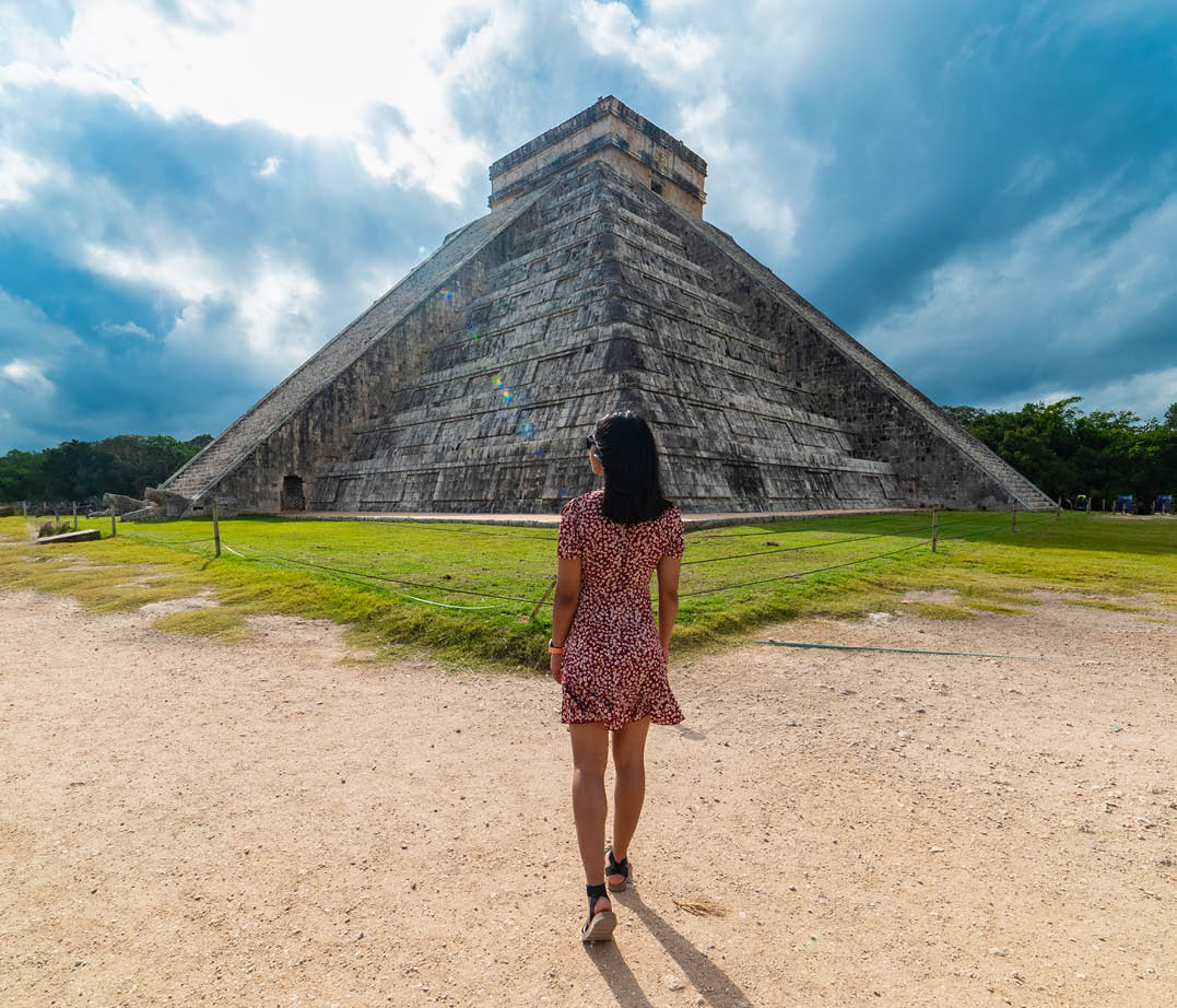 Woman with Chichen Itza Mayan Ruins in the background Yucatan Mexico