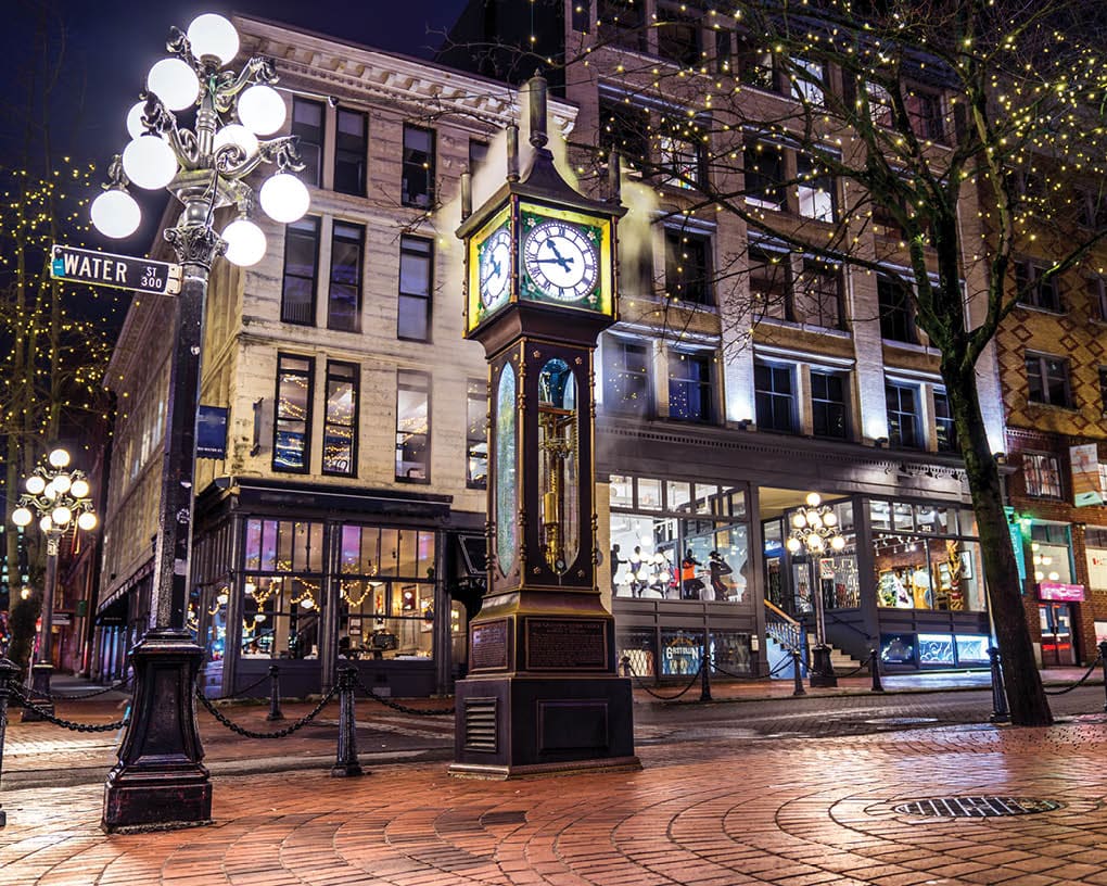 Vancouver, British Columbia - Canada. Downtown iconic landmark on a chilly night just after a rain, the Steam Clock, Gastown- Vancouver, British Columbia, Canada.