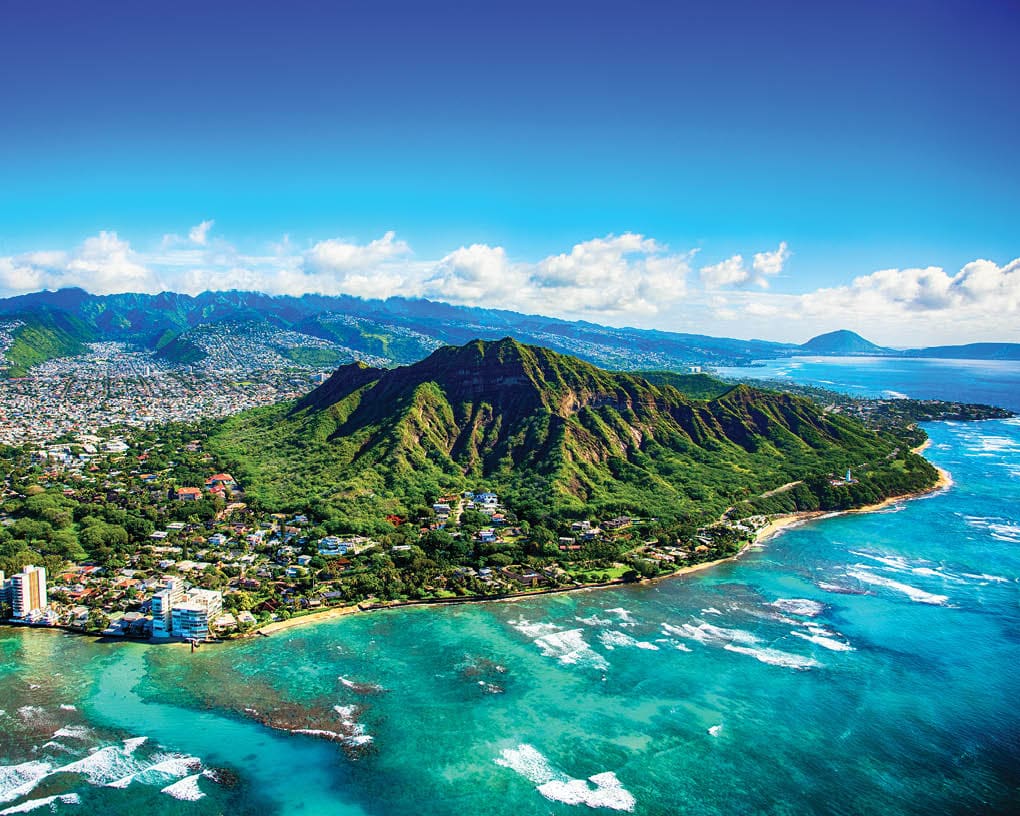 The dormant volcano known as Diamond Head located adjacent to downtown Honlulu, Hawaii, as shot from an altitude of about 1500 feet over the Pacific Ocean.