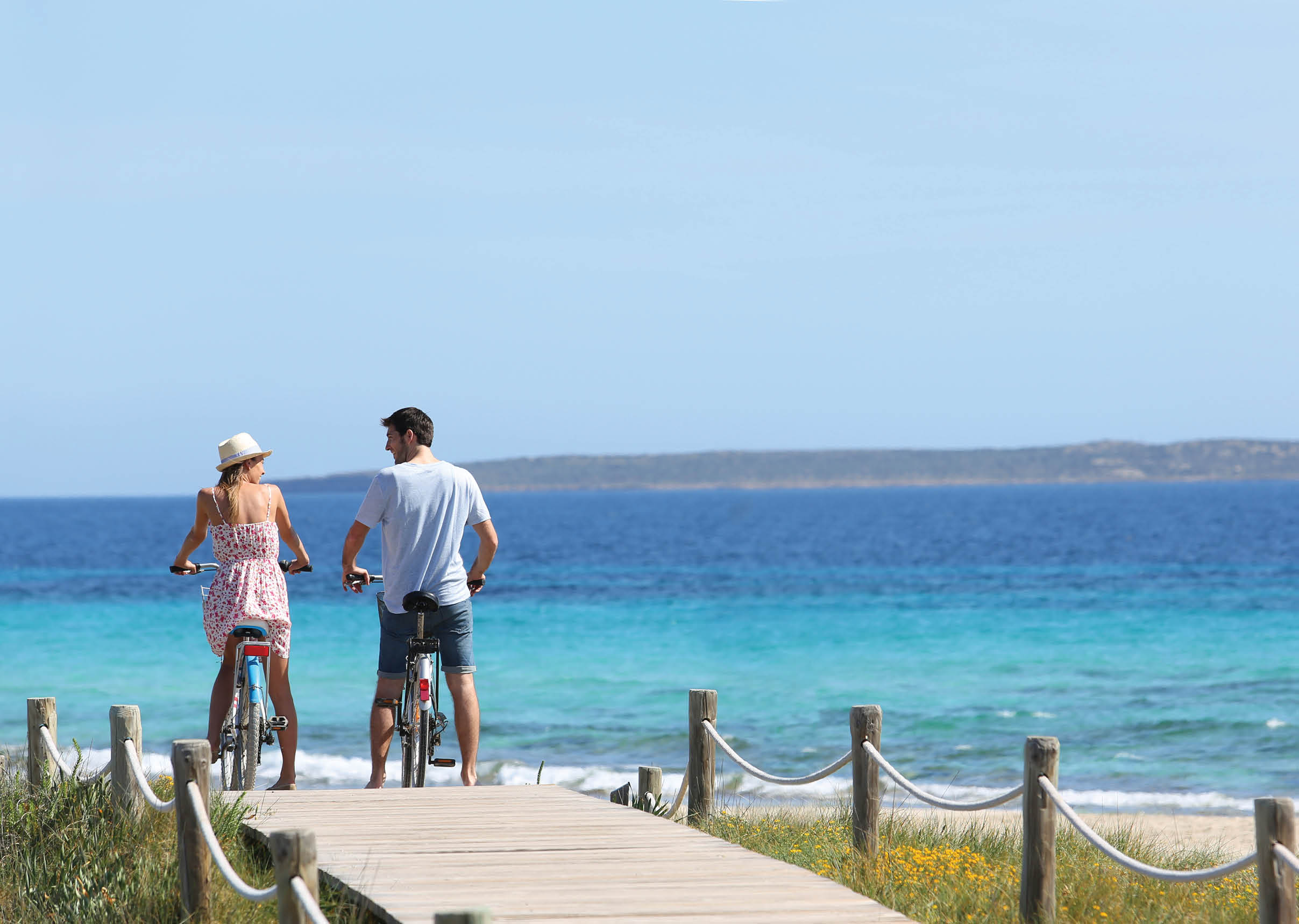 Couple riding bikes on Formentera Island