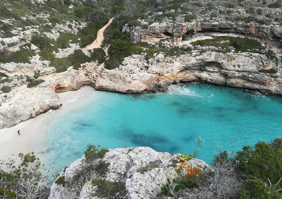 A man alone in a paradise beach in Mallorca Island  Cala Marmols 