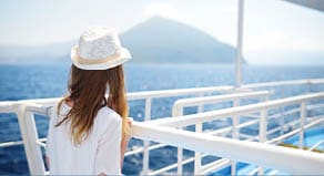 Adorable young girl enjoying ferry ride staring at the deep blue sea  Child having fun on summer family vacation in Greece  Kid sailing on a boat 