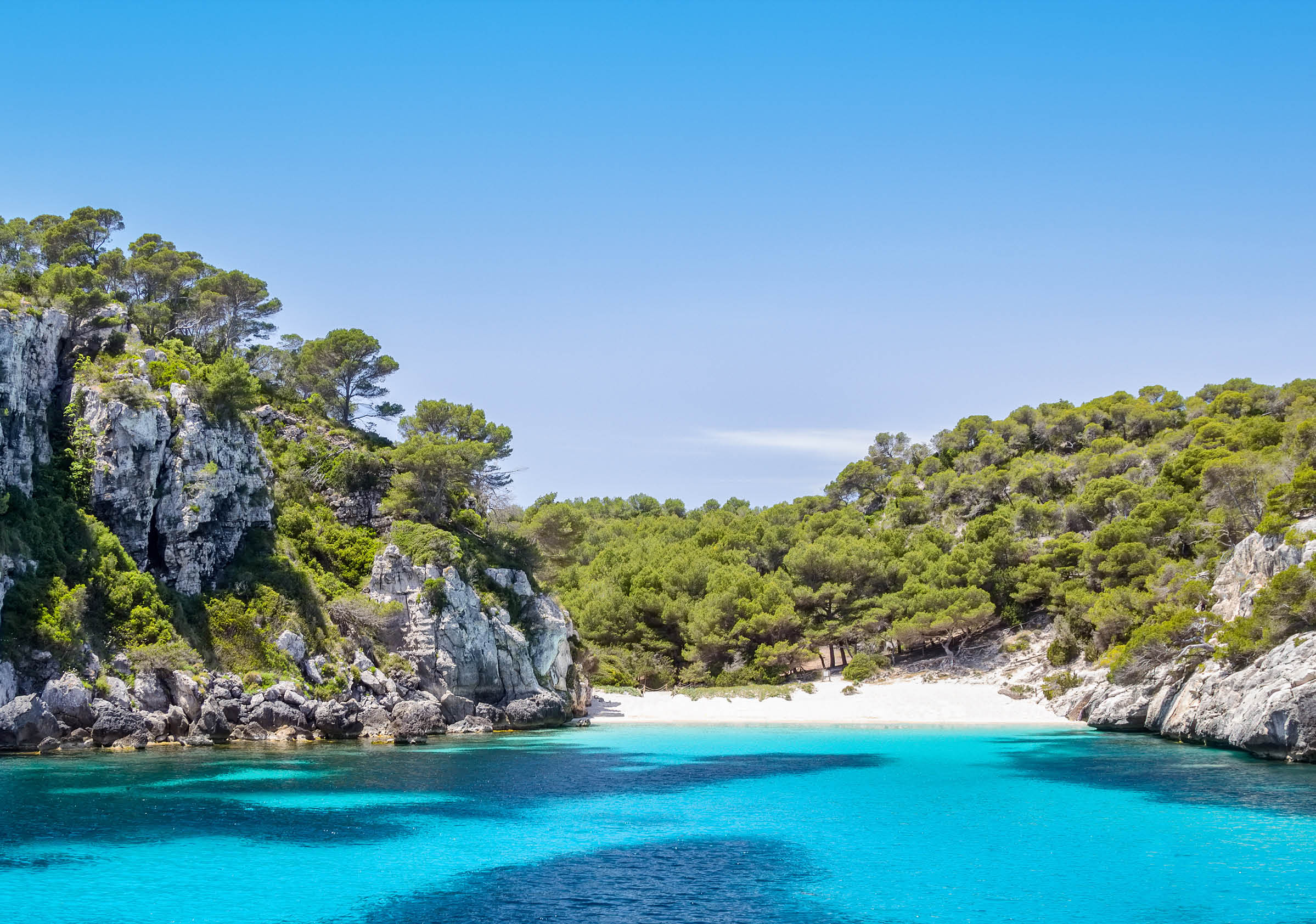 Cala Macarelleta - one of the most popular natural beaches of Menorca Island, Spain