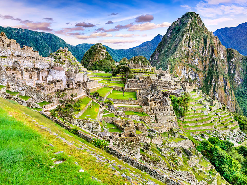 Machu Picchu in Peru - Ruins of Inca Empire city and Huaynapicchu Mountain in Sacred Valley, Cusco, South America 