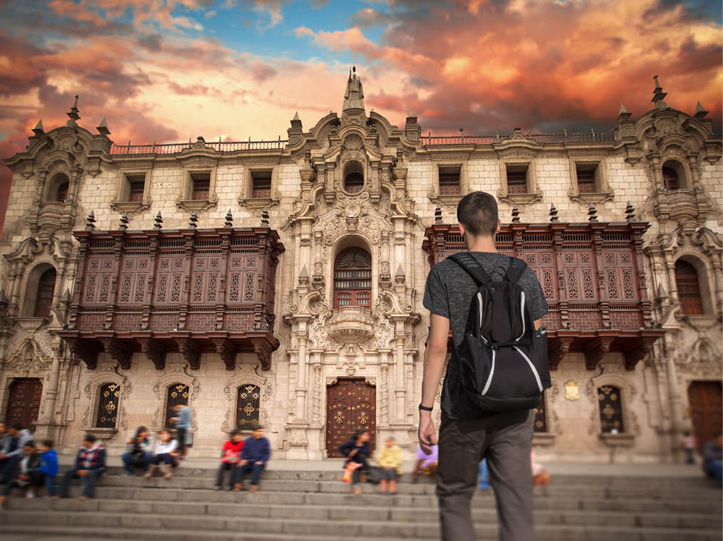 a male tourist is traveling around the city of Lima, Peru 
