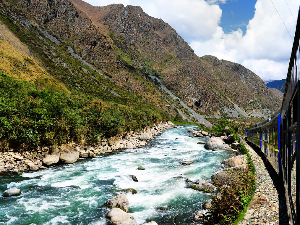 Peruvian train to Machu Picchu along the Urubamba River 