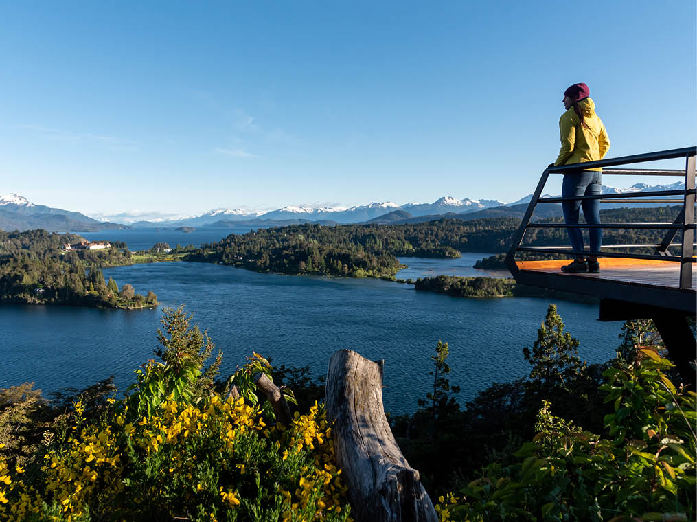 Woman admiring the beauty of argentinian Lake District in San Carlos de Bariloche