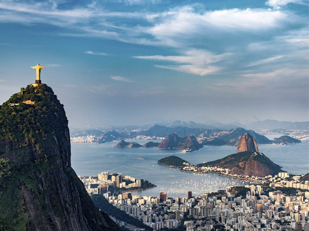 Aerial view of Rio De Janeiro  Corcovado mountain with statue of Christ the Redeemer, urban areas of Botafogo, Flamengo and Centro, Sugarloaf mountain 