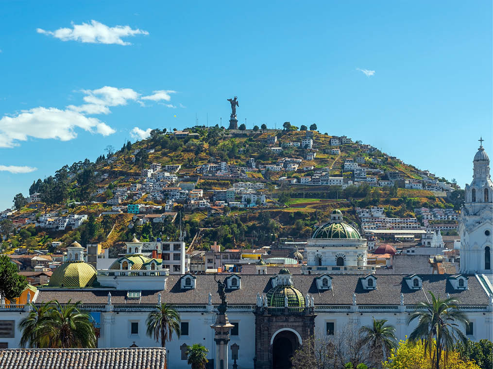 Metropolitan Cathedral facade with the Panecillo Hill in the background and the Virgin of Quito on top, Quito, Ecuador 