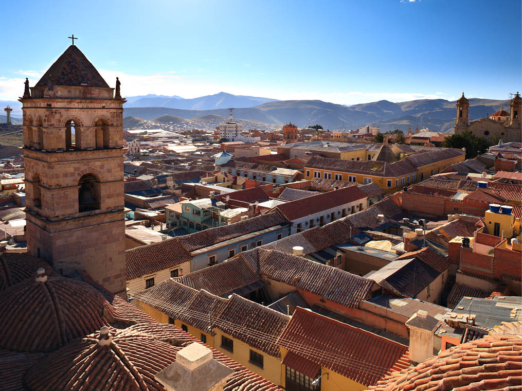 A rooftop view of the colorful city of Potosí, Bolivia, the highest in the world, at over 4,090 m (13,420 feet) elevation  In the foreground you can see parts of the San Francisco Church and Convent (1547), and in the distant right you can see the main Cathedral, first completed in 1600  The city of Potosí was one of the largest cities in the world during the 16th and 17th centuries -- it´s population exceeding that of Paris and London at that time 