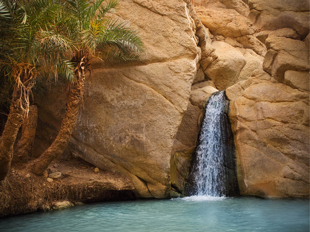 View of mountain oasis Chebika with waterfall, Sahara desert, Tunisia, Africa