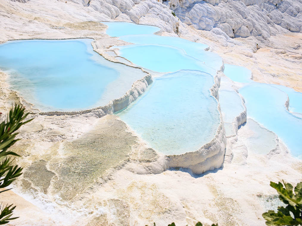 Travertines with turquoise water in Pamukkale, Turkey 
