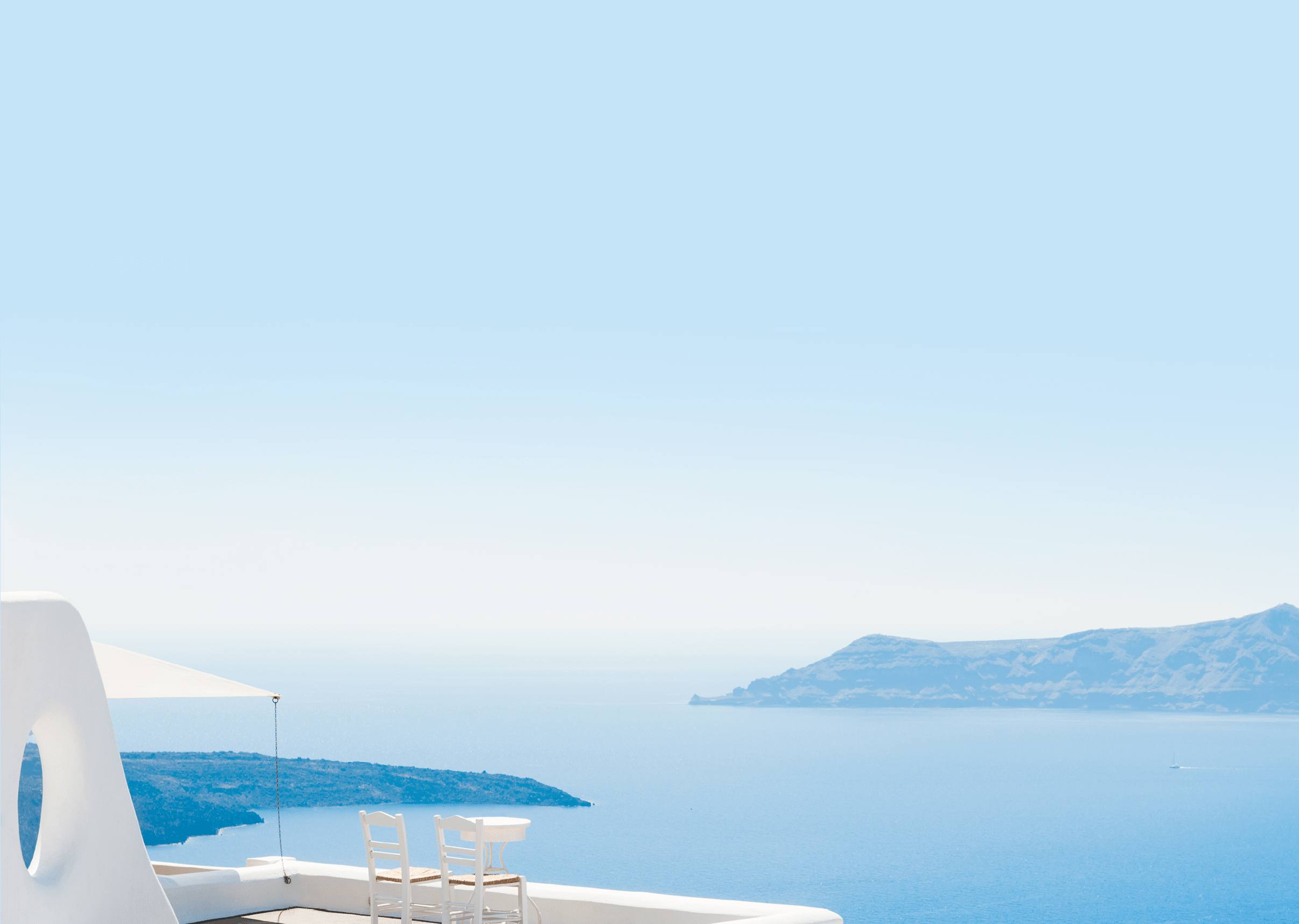 Two chairs on the terrace with sea views  Santorini island, Greece  Travel and vacation background