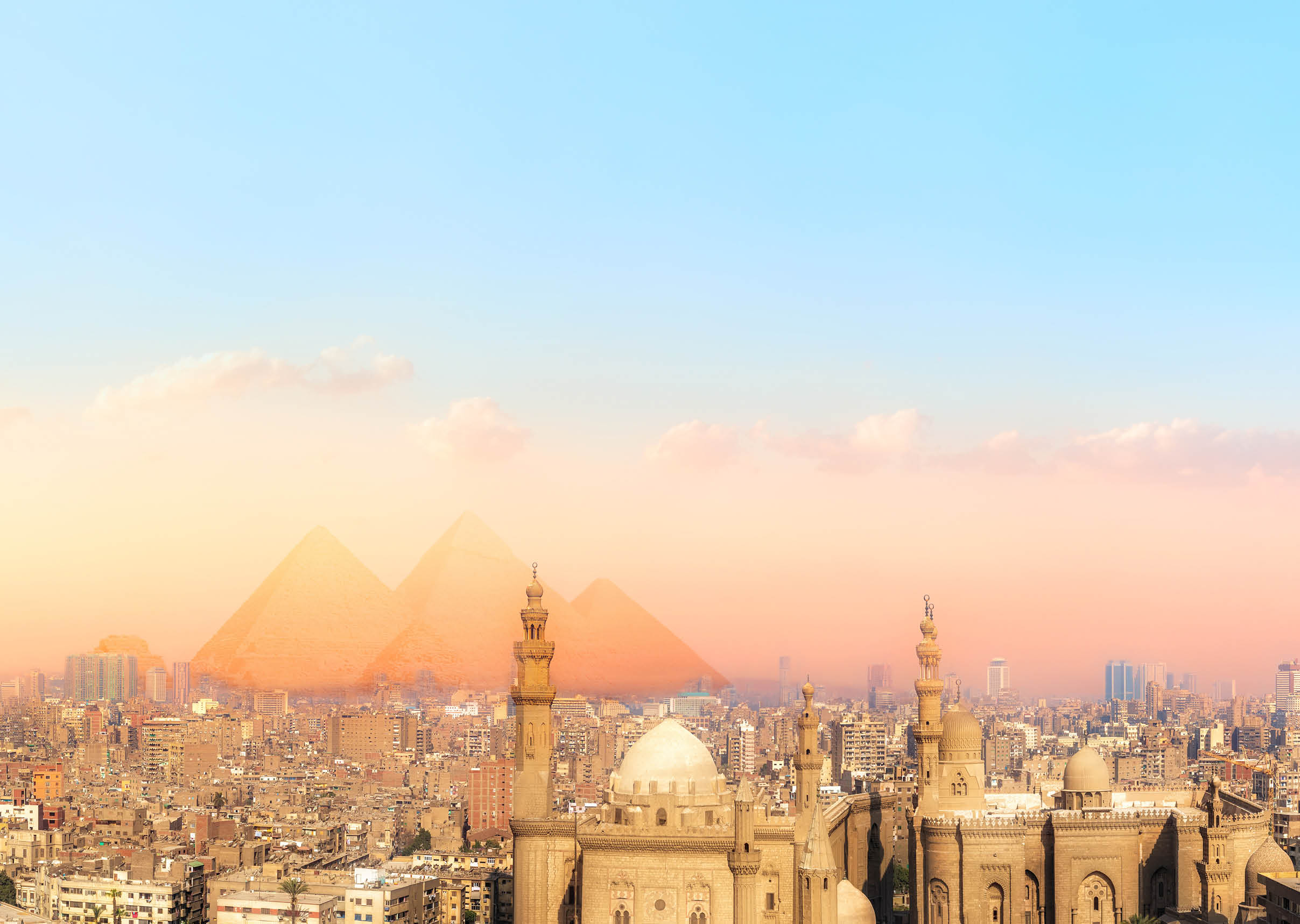 Sights of Cairo panorama: the Mosque-Madrassa of Sultan Hassan, the city view and the Pyramids 